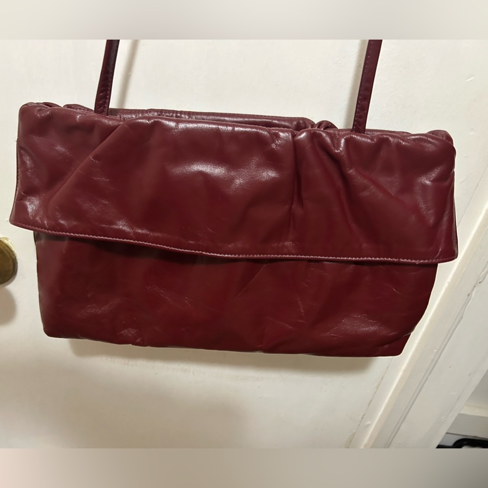 Vintage 80’s burgundy bag. Can be carried as a clutch or with strap. Like new!
